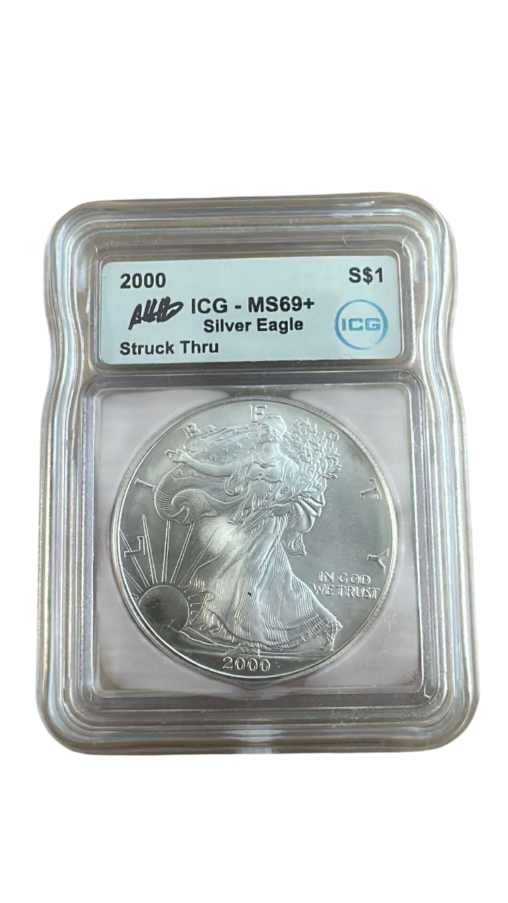 2000 Silver Eagle Struck Thru Error – ICG MS69+ Austin Hutto Signature - CoinsTV